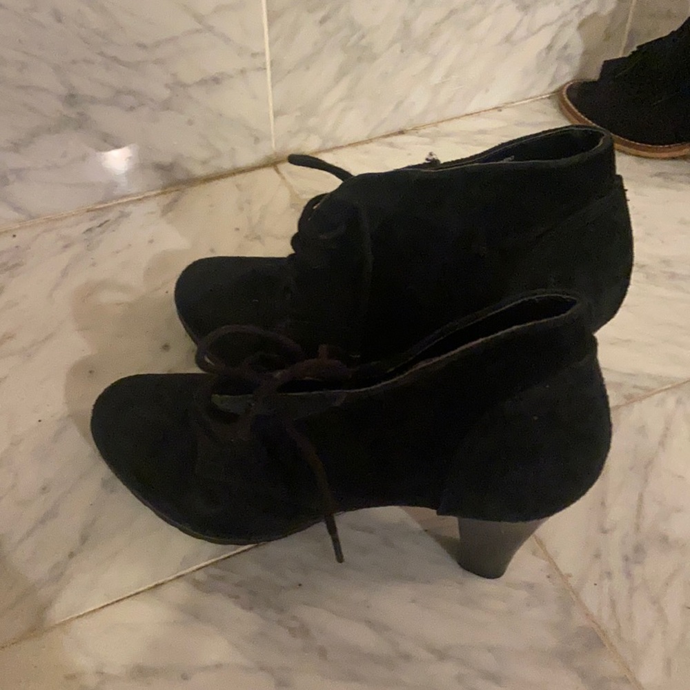 Cool high heeled suede black booties.